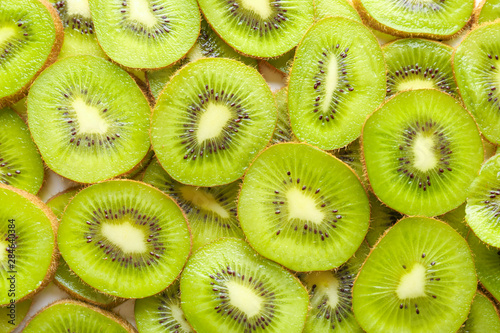 Slices of ripe kiwi as background
