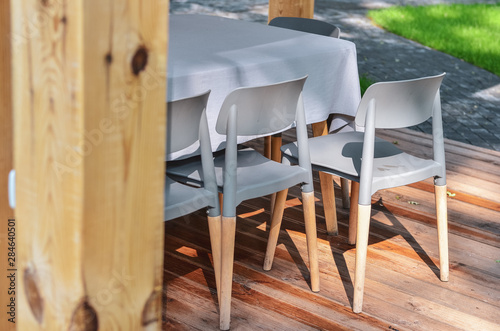 Close up of wooden chairs in outdoor terrace