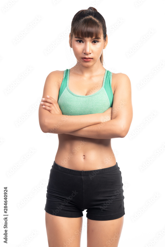Fitness woman white background. Asian woman. Arm cross, high confident mood. Fitness woman white background. Asian woman. Arm cross, high confident mood.