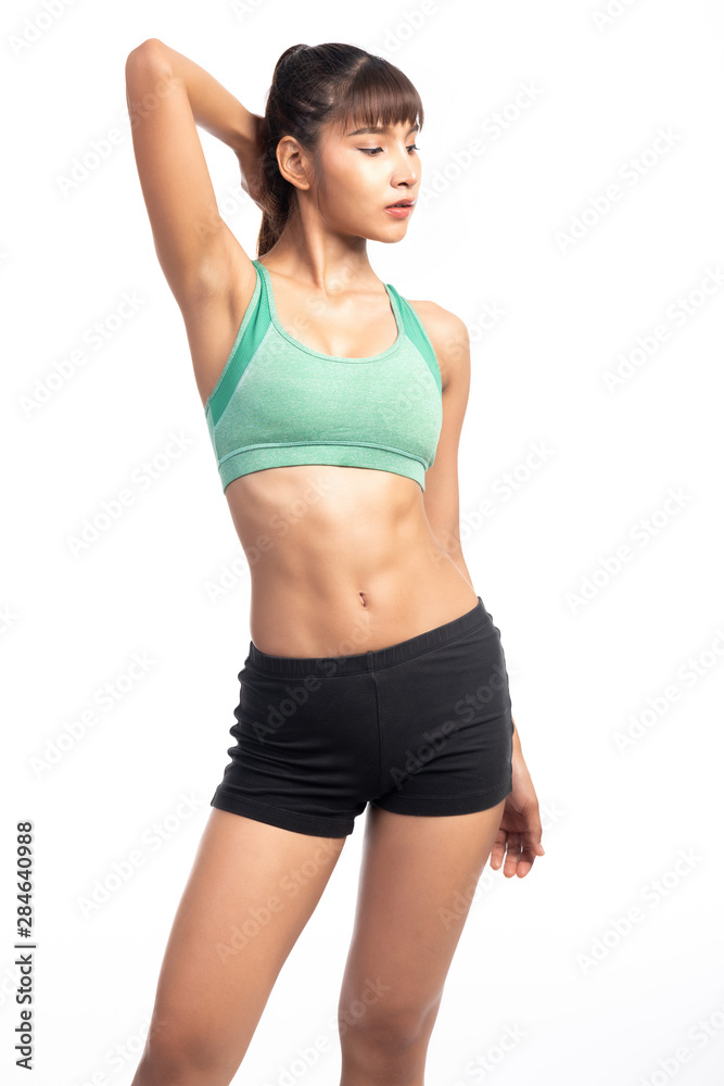 Fitness woman white background. Asian woman. Hand behind neck.