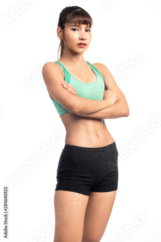 Fitness woman white background. Asian woman. Arm cross, very confident look.