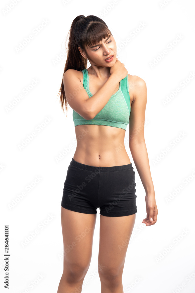 Fitness woman in pain. Asian girl, rubbing her neck. Fitness woman in pain. Asian girl, rubbing her neck.