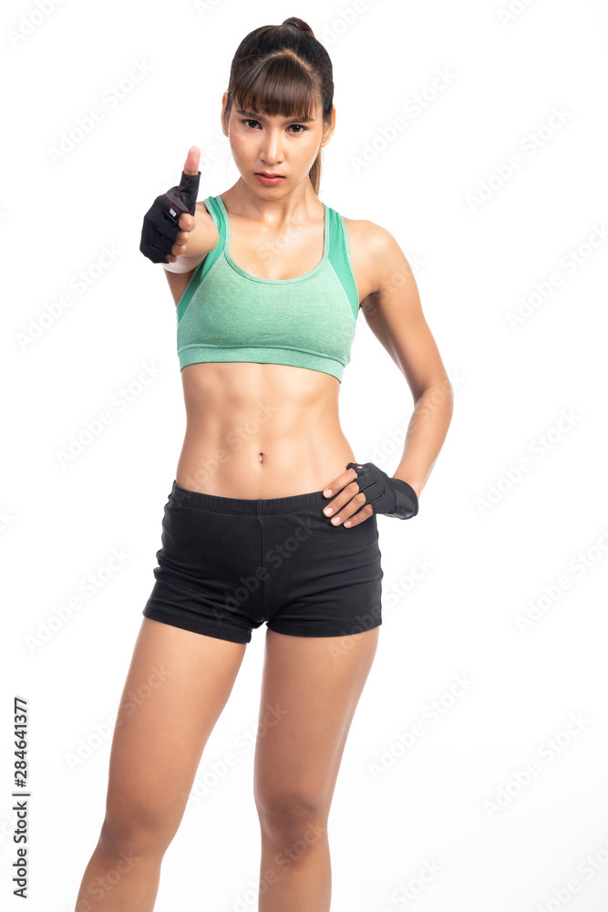 Mix martial art woman portrait in white background. Asian girl, thumb up pose.