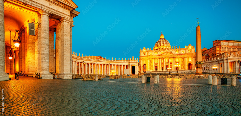 St. Peter's Basilica in the evening from Via della Conciliazione in Rome. Vatican City Rome Italy. Rome architecture and landmark.  St. Peter's cathedral in Rome. Illumination of Rome and Vatican.