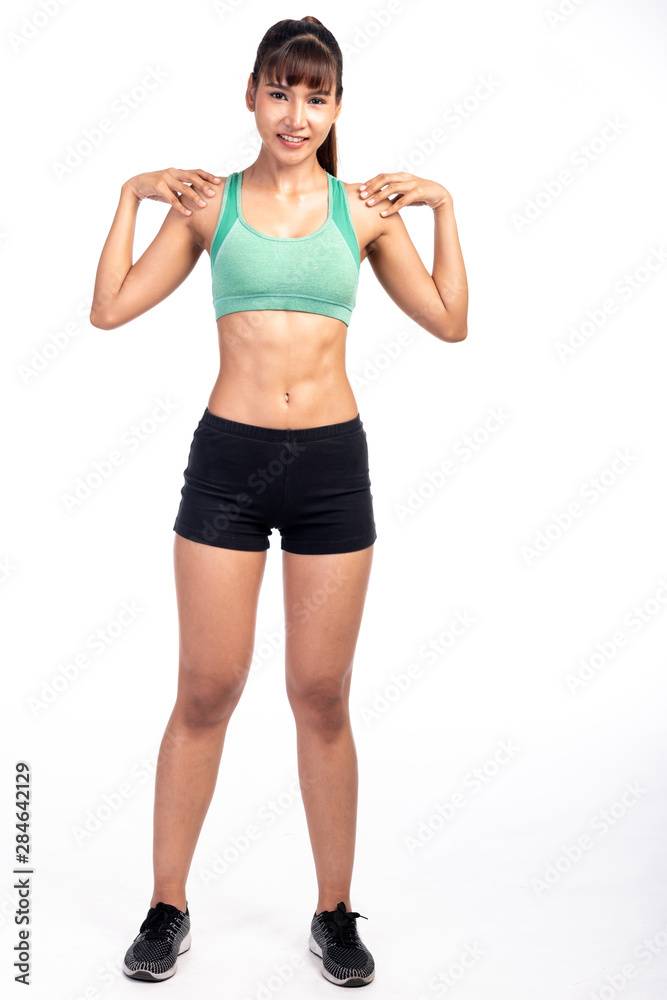 Fitness woman stretching isolated in white background. Asian girl in full body shot. Both shoulder stretch with smile. Fitness woman stretching isolated in white background. Asian girl in full body shot. Both shoulder stretch with smile.