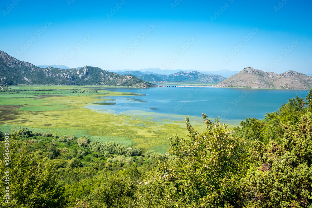 Skadar Lake in Montenegro, wetland and mountain views.
