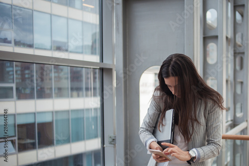 stressful young woman is a businesswoman who took an unpleasant message in a business chat.