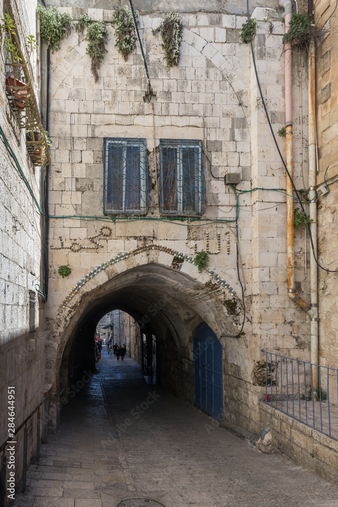 Narrow street in the Muslim quarter near the Heros Gate on old city of Jerusalem, Israel