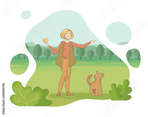 A young woman throws a ball to his dog in the summer Park