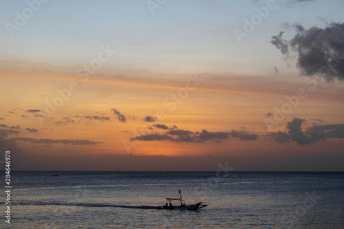A traditional small fishing boat sailing in the ocean