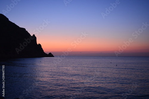 Headland and sea cliffs of Cabo de San Antonio viewed from Javea at sunrise.