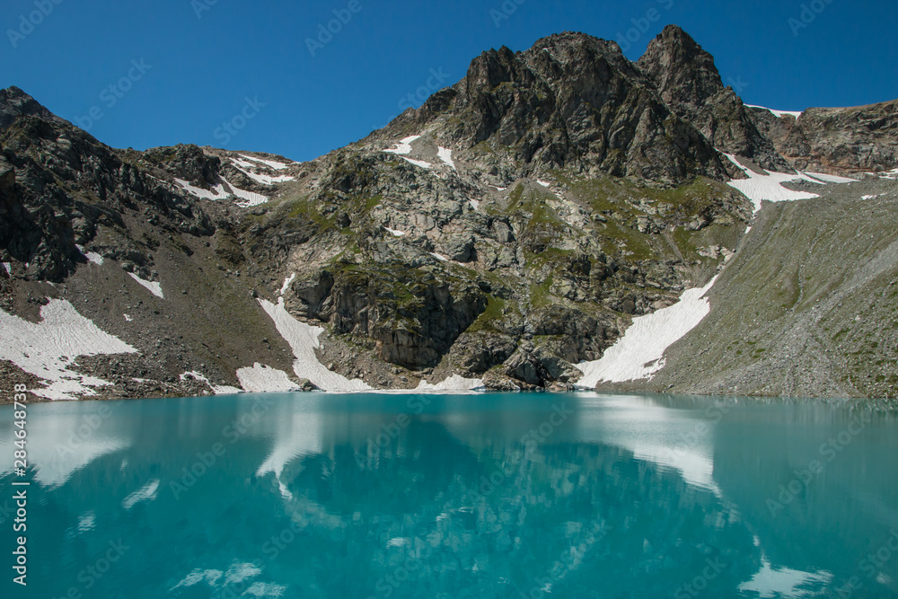 Mountain landscape, Fantastic colorful morning lake and mountain range. Mountain Caucasus near Arkhyz