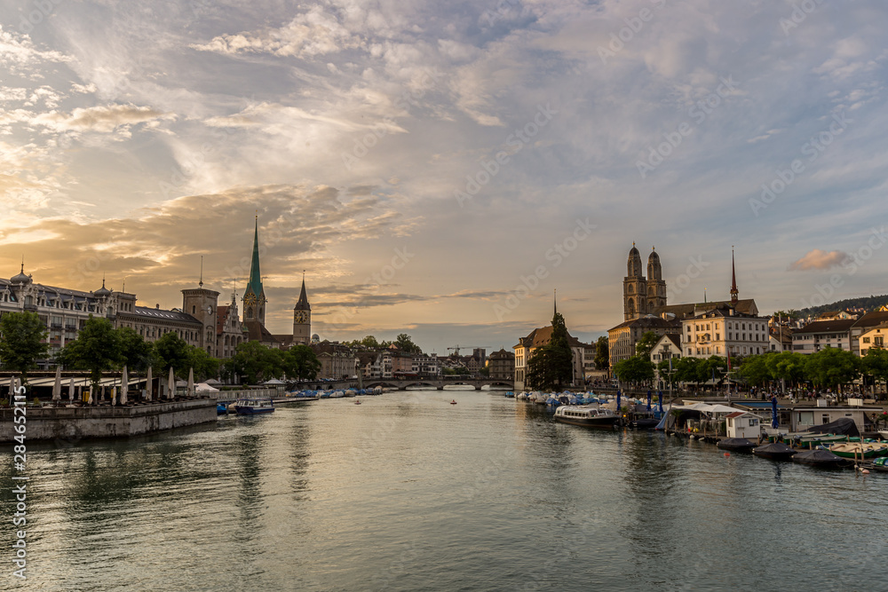 Historic Zurich downtown skyline with Fraumunster and Grossmunster churches at lake zurich during sunset, Switzerland
