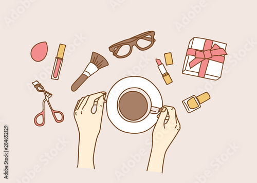 Coffee with makeup cosmetics kit and other accessories on color background. 