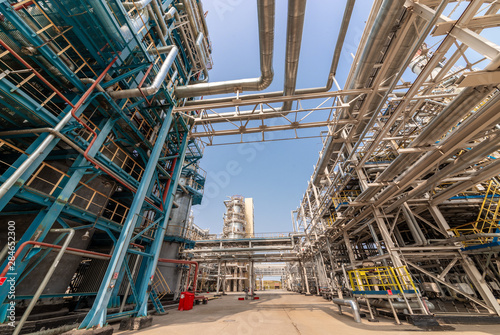 low angle view of metal pipes of industrial plant outdoor 