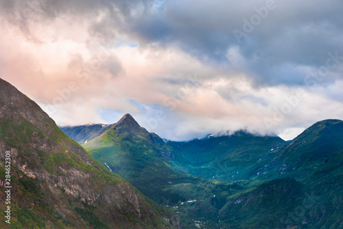 Mountains with clouds at sunset, Norway. Beautiful summer landscape.