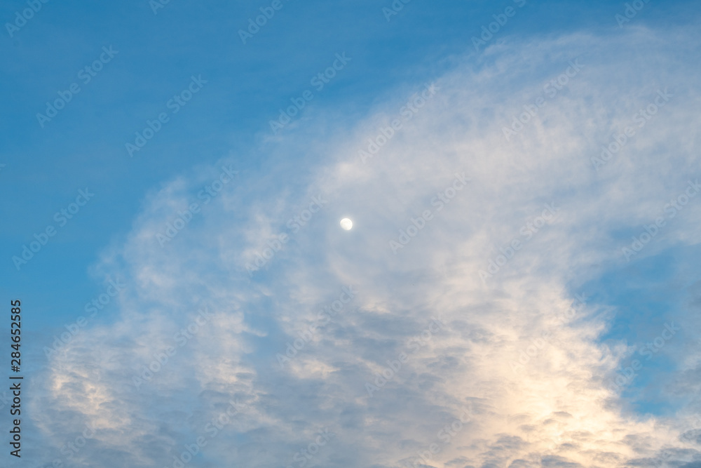 Beautiful blue sky with cloudy and moon on the day, when the sun is about to set. sky background with moon light.