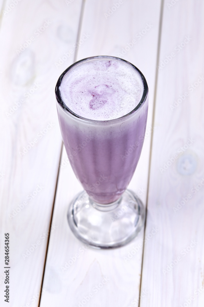 berry smoothie on the wooden background berry smoothie on the wooden background