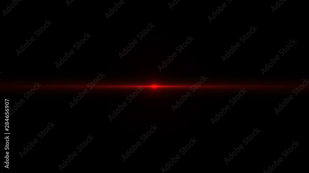 Laser red light rays flash abstractly against a dark background. Festive performance. Laser red light rays flash abstractly against a dark background. Festive performance.