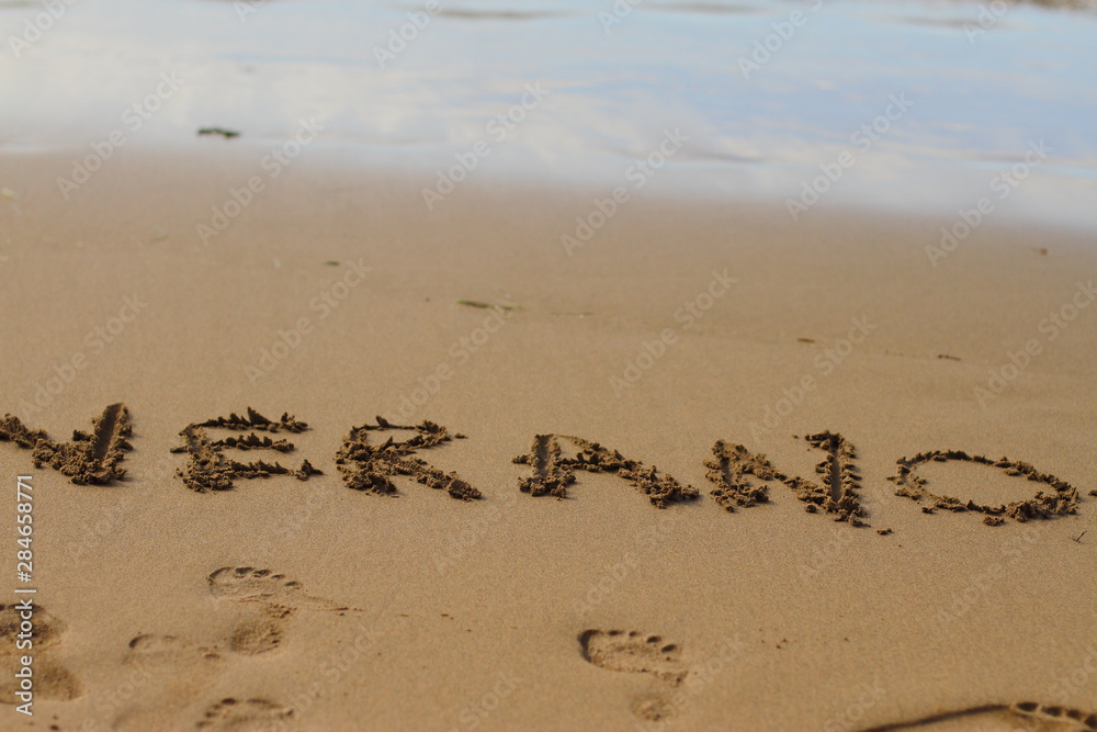 Verano, 2019, word summer is written on the sand Verano, 2019, word summer is written on the sand