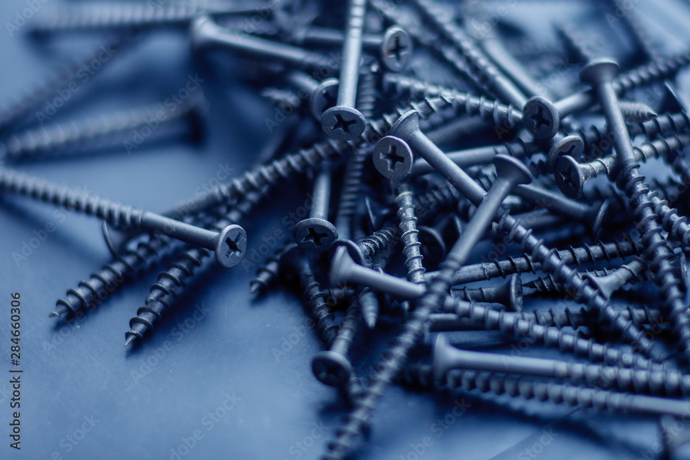 Steel tapping screws abstract background Steel tapping screws abstract background