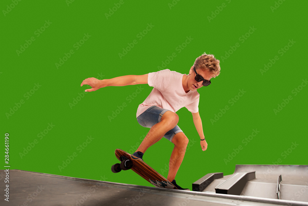 Skateboarder on green screen background.