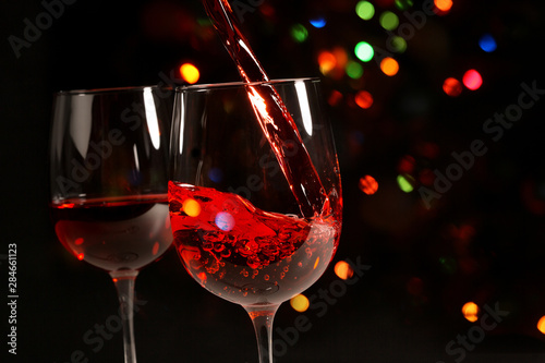 Beautiful splash of red wine in a glass