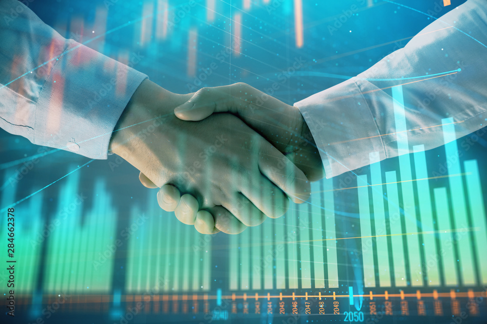 Multi exposure of forex graph on abstract background with two businessmen handshake. Concept of success on stock market
