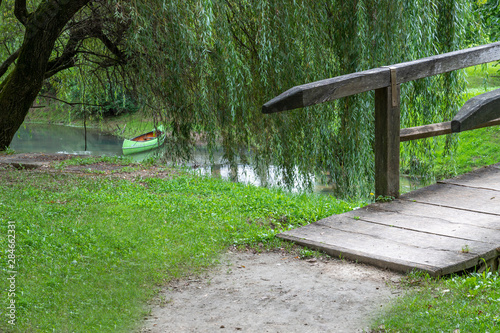 Kostanjevica na Krki, wooden bridge over the river photo