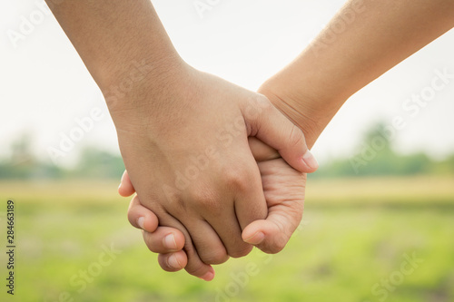 Couple holding hands