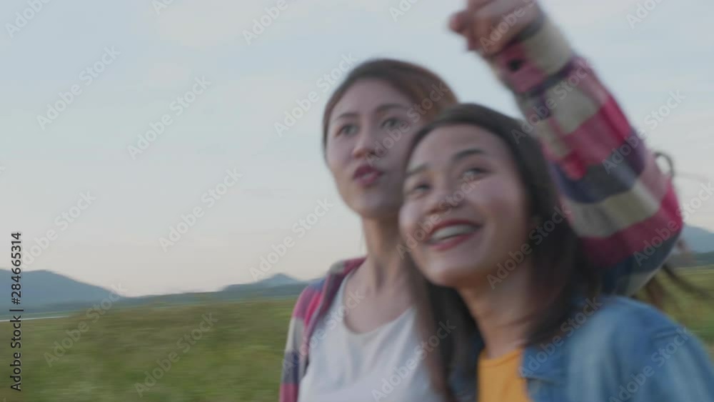 Traveler asian women lesbian LGBT couple feel happy walking on summer holiday vacation. Lifestyle and traveling concept. Traveler asian women lesbian LGBT couple feel happy walking on summer holiday vacation. Lifestyle and traveling concept.