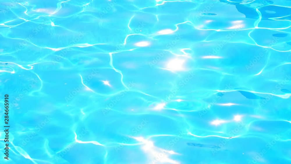 background of blue water in the pool bright sun background of blue water in the pool bright sun