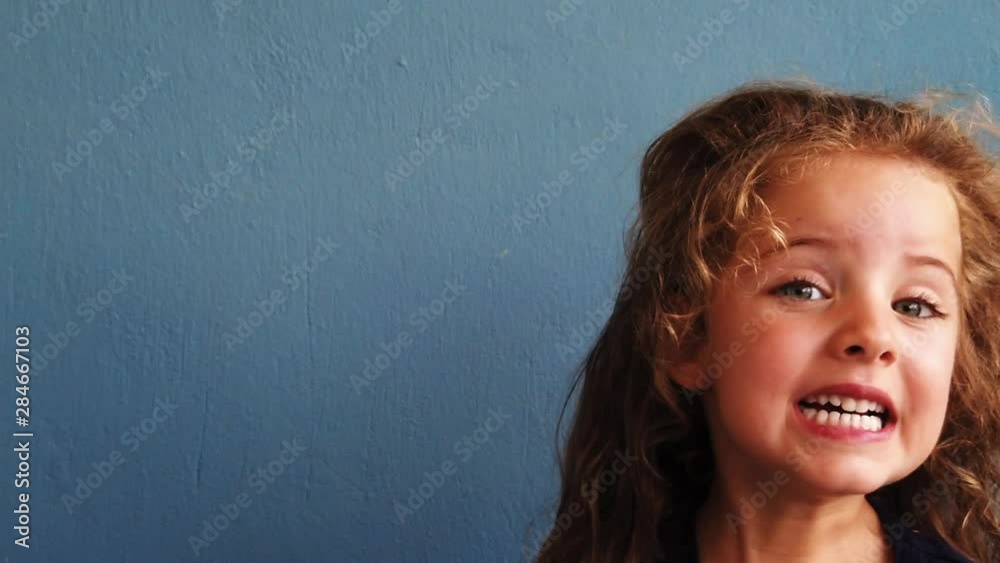 Adorable 4 years old girl is having fun with her funny face. Adorable 4 years old girl is having fun with her funny face.