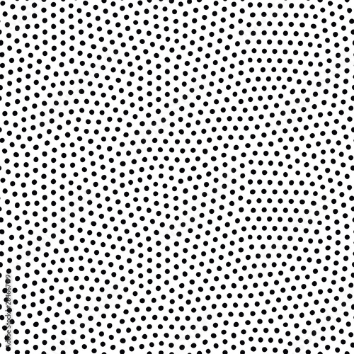 Seamless dot pattern with randomly disposed spots. Dotted background. Black and white vector trendy texture.