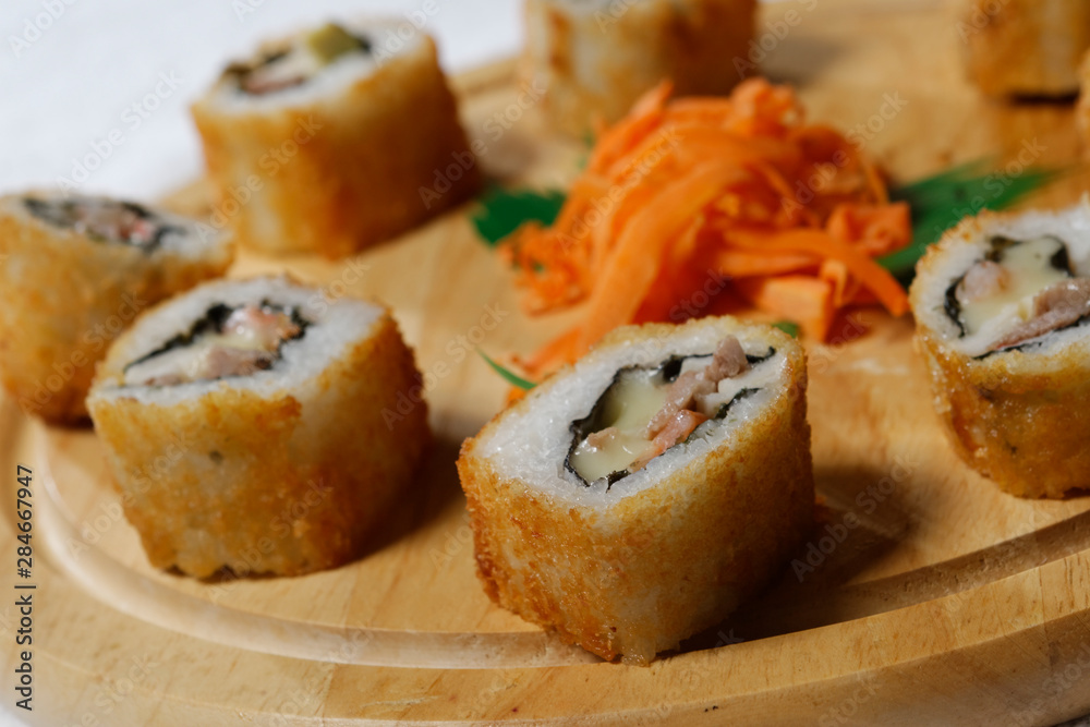 Sushi is traditionally made with medium-grain white rice. It is very often prepared with seafood, such as squid, eel, yellowtail, salmon, tuna or imitation crab meat.