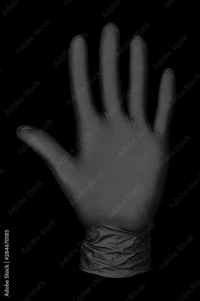 Fototapeta premium black glove on black background / abstract photo background image