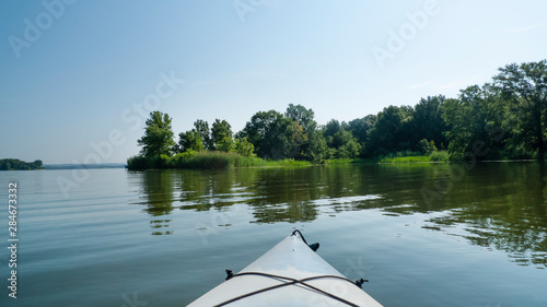 Kayaking a lake in summer with gentle ripples
