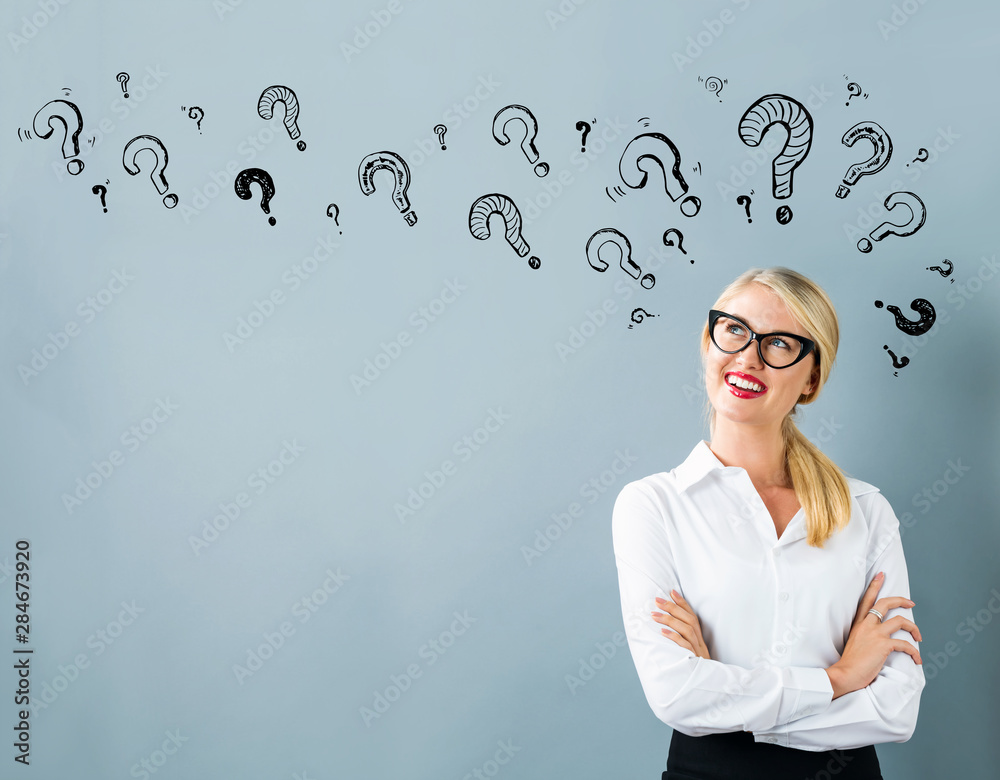Question marks with young woman in a thoughtful face Question marks with young woman in a thoughtful face