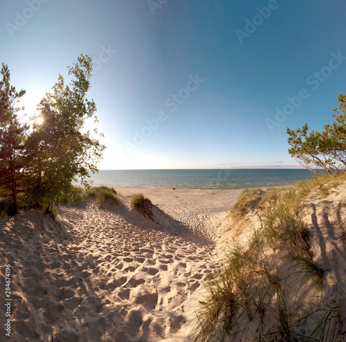 Fototapeta Naklejka Na Ścianę i Meble -  Slowinski National Park on the Baltic Sea coast, near Leba, Poland. Beautiful sandy beach, dune vegetation and coastal landscape on the walking trail between Leba and Moving Dunes.
