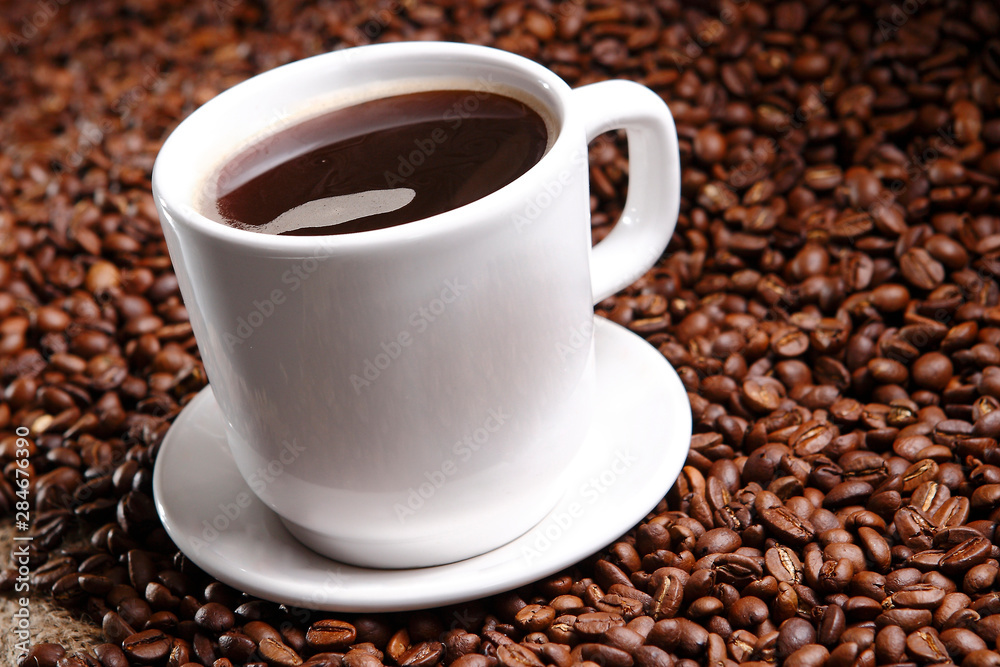 Coffee with grains and sweet bread. Coffee is a brewed drink prepared from roasted coffee beans, the seeds of berries from certain Coffea species. Coffee with grains and sweet bread. Coffee is a brewed drink prepared from roasted coffee beans, the seeds of berries from certain Coffea species.