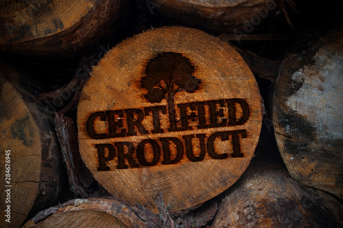 Tree trunks with logo branding certified product photo