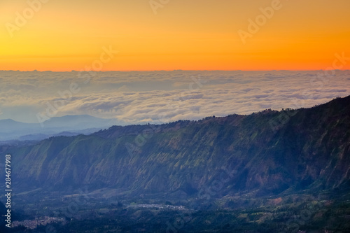 The beautiful sunrise at Mount Bromo volcano  the magnificent view of Mt. Bromo located in Bromo Tengger Semeru National Park  East Java  Indonesia.Image contains noise grain and blurry.
