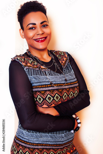 young pretty african american woman happy smiling posing against white background, lifestyle people concept © iordani