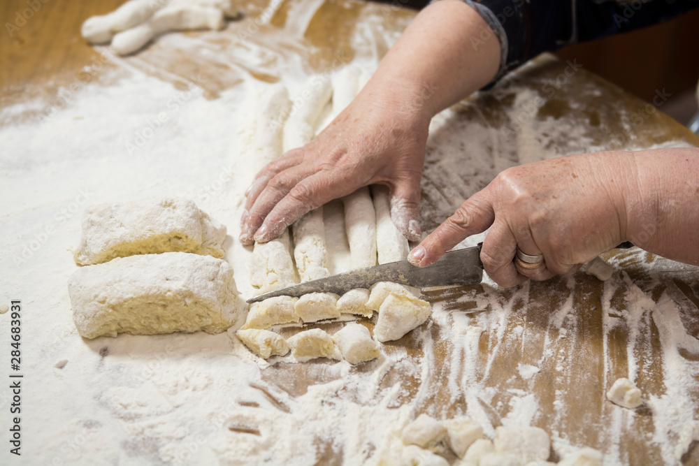Mass of handmade gnocchi and cooking elements Mass of handmade gnocchi and cooking elements