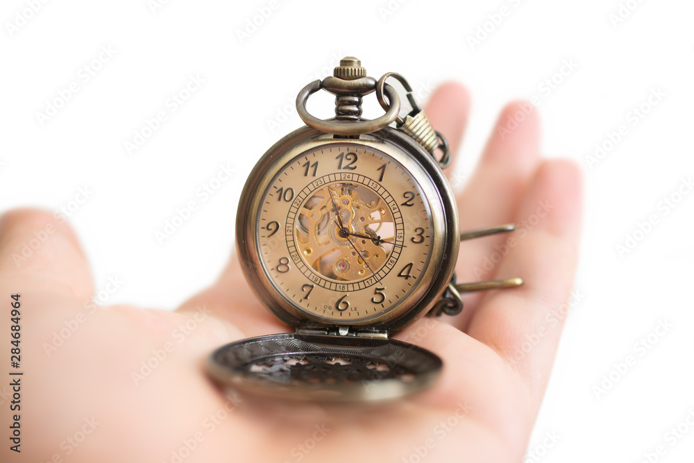 Men hands hold a pocket watch and a white background. Men hands hold a pocket watch and a white background.
