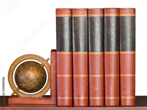 Encyclopedia on Shelf with Globe on White photo