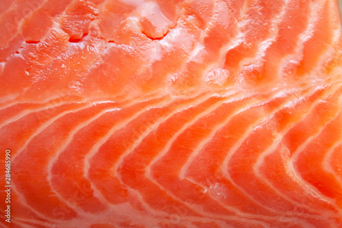 Fresh raw salmon fish textured fillet detail abstract background