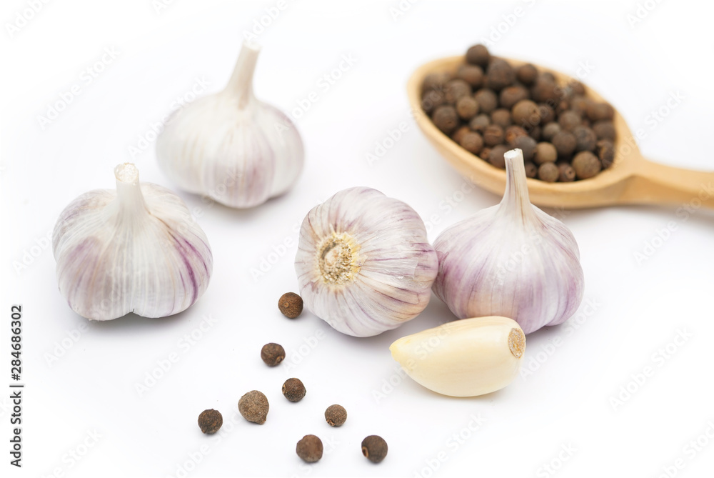 isolated garlic. fresh garlic with black allspice isolated garlic. fresh garlic with black allspice