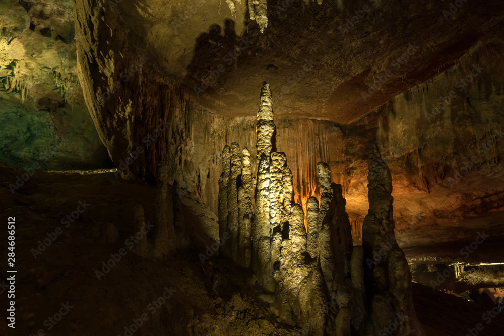Stalagmites with multi-colored lighting Prometheus Cave, Georgia