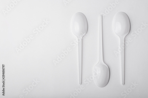 Three plastic spoon on white background.